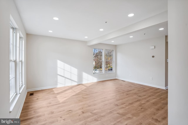 spare room with light hardwood / wood-style floors