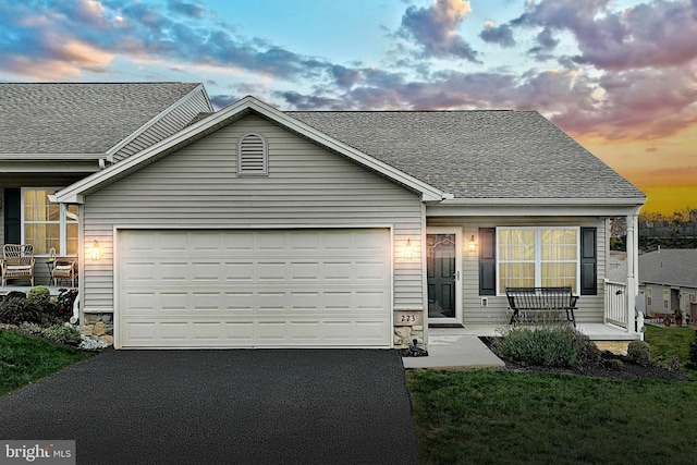 223 Jutland Way Unit 266, Red Lion, PA 17356 - view of front of home with an attached garage, asphalt driveway, covered porch, and a shingled roof