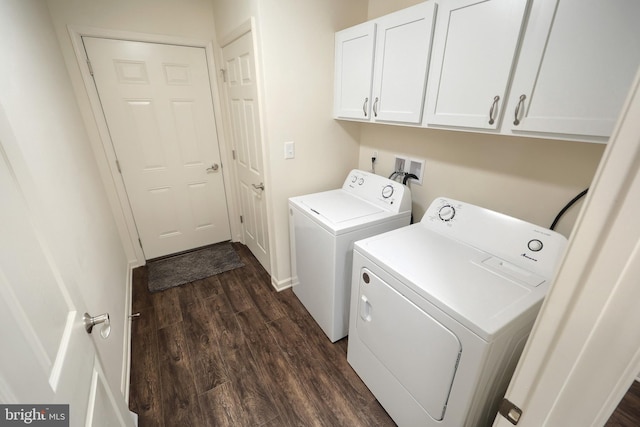 clothes washing area with cabinets, dark hardwood / wood-style floors, and washing machine and dryer