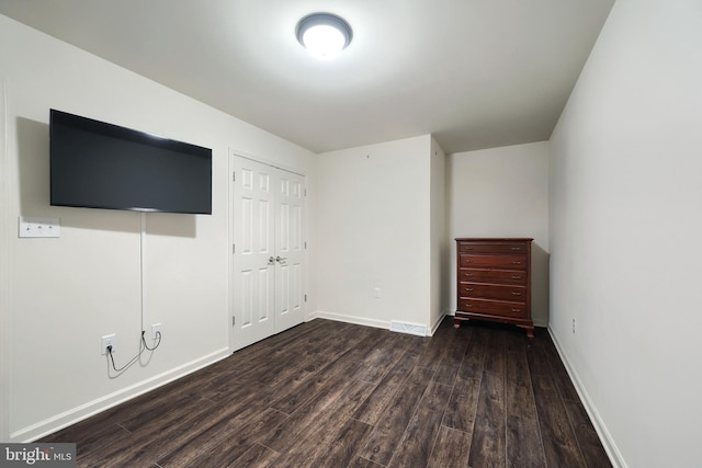 223 Jutland Way Unit 266, Red Lion, PA 17356 - unfurnished bedroom with dark wood-type flooring, a closet, and baseboards