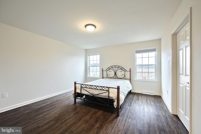 bedroom featuring dark hardwood / wood-style floors