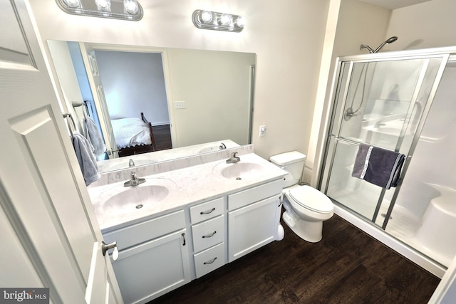223 Jutland Way Unit 266, Red Lion, PA 17356 - ensuite bathroom with toilet, a stall shower, wood finished floors, and double vanity