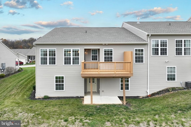 223 Jutland Way Unit 266, Red Lion, PA 17356 - back of property with a patio, a yard, central AC unit, a deck, and roof with shingles