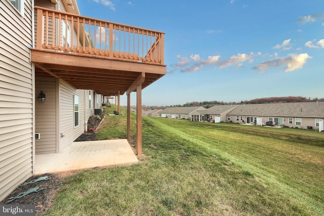 view of yard featuring a deck and a patio area