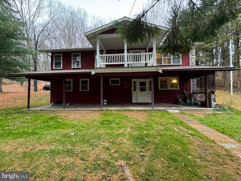 224 Shaffer Rd, Imler, PA 16655 - rear view of property with a yard, a balcony, and board and batten siding