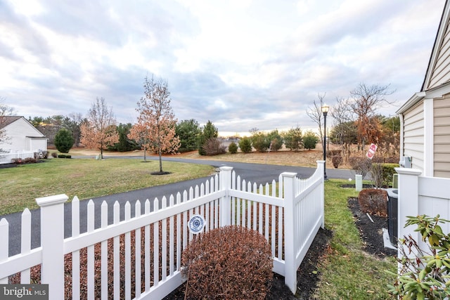 wooden deck featuring a yard