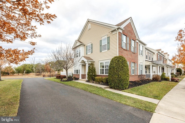 view of side of home featuring a yard