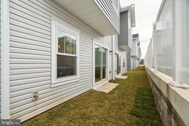 view of home's exterior featuring a lawn