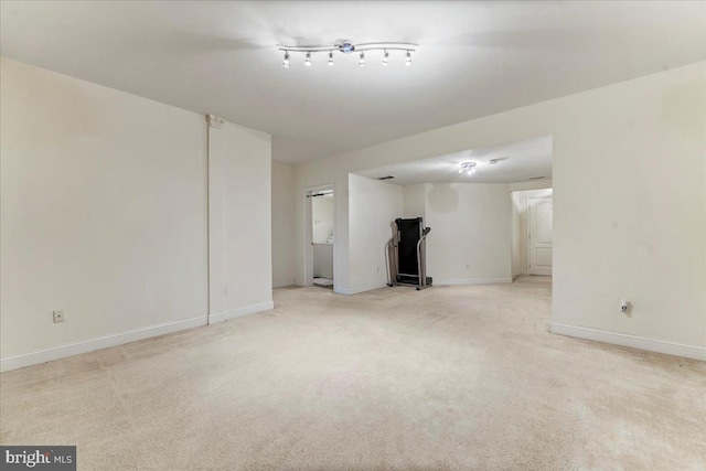 empty room featuring light carpet