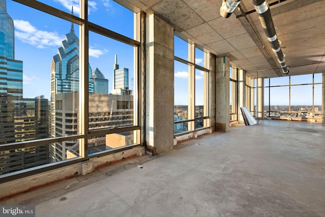 miscellaneous room featuring concrete floors and expansive windows