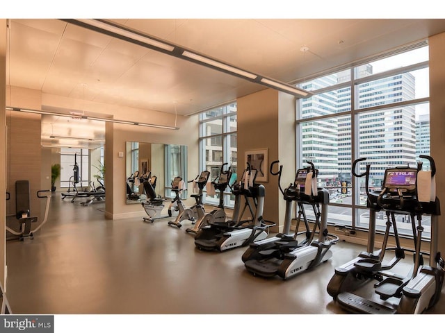 workout area featuring expansive windows