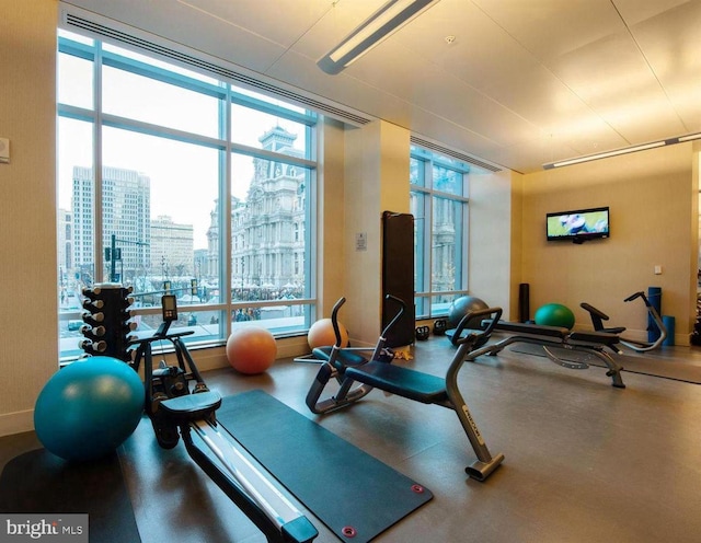 exercise room with plenty of natural light and a wall of windows