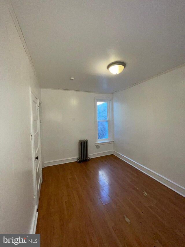 2014 Castor Ave, Philadelphia, PA 19134 - unfurnished room with radiator, wood finished floors, and baseboards