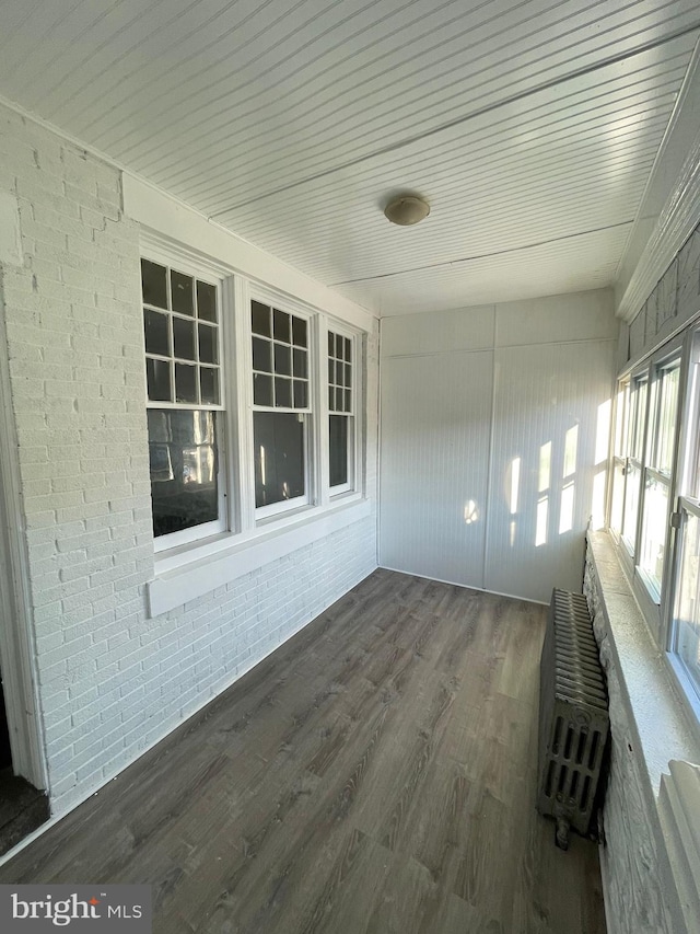 2014 Castor Ave, Philadelphia, PA 19134 - unfurnished sunroom with wood finished floors and brick wall