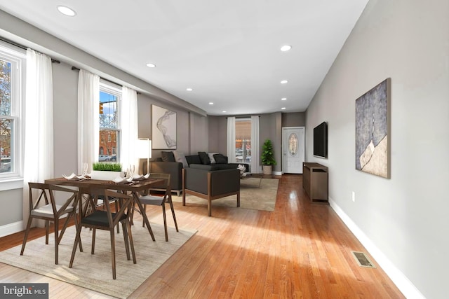 639 S Conkling St, Baltimore, MD 21224 - dining space with light wood-style floors, baseboards, and recessed lighting