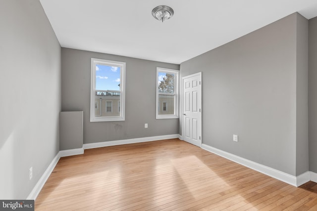 empty room with light wood-type flooring