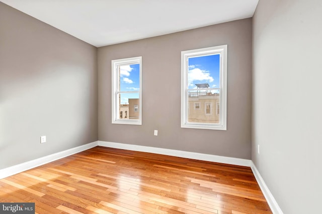 639 S Conkling St, Baltimore, MD 21224 - spare room with hardwood / wood-style floors and baseboards