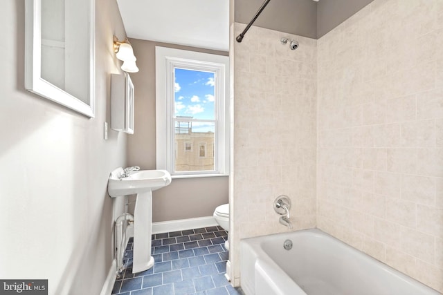 639 S Conkling St, Baltimore, MD 21224 - bathroom featuring toilet, baseboards, tile patterned flooring, and shower / tub combination