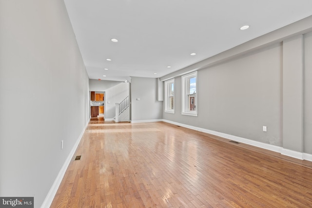 unfurnished living room with light hardwood / wood-style flooring