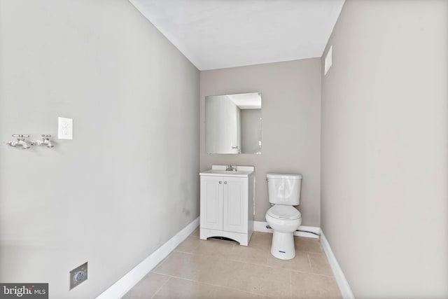 639 S Conkling St, Baltimore, MD 21224 - bathroom with toilet, vanity, baseboards, and tile patterned floors