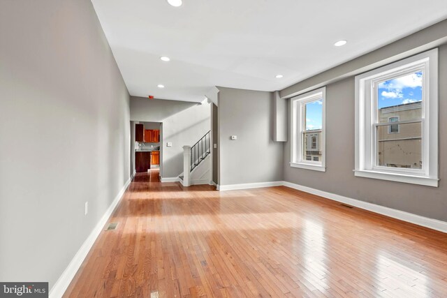 639 S Conkling St, Baltimore, MD 21224 - kitchen with black appliances, baseboards, ceiling fan, glass insert cabinets, and light wood-style flooring