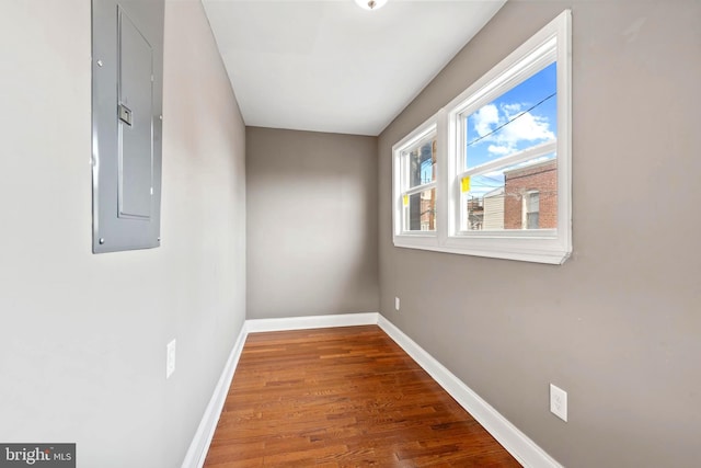 639 S Conkling St, Baltimore, MD 21224 - unfurnished room with electric panel, baseboards, and wood finished floors
