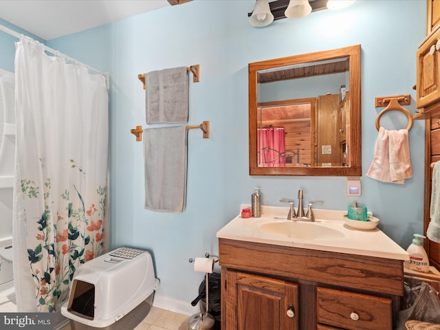 bathroom featuring walk in shower, tile patterned flooring, vanity, and toilet