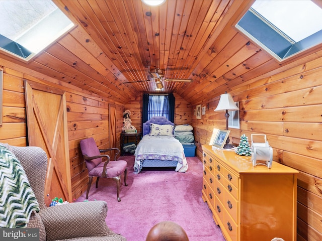 bedroom featuring wood walls, lofted ceiling with skylight, carpet floors, and wooden ceiling