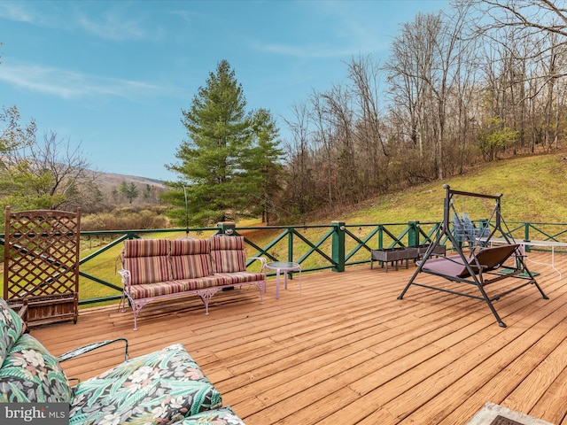 wooden terrace with a yard