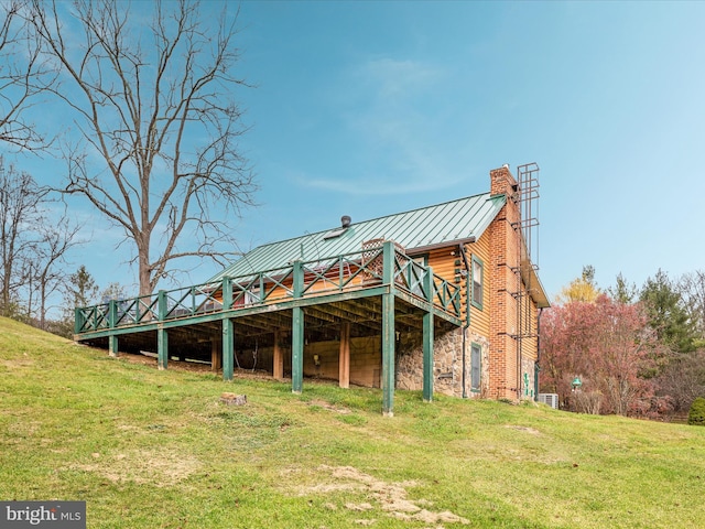 exterior space with a lawn and a deck