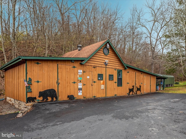 view of outbuilding with a carport