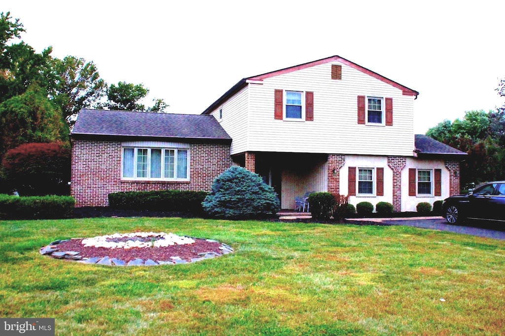 110 Andrea Dr, Richboro, PA 18954 - view of front of home with brick siding and a front lawn