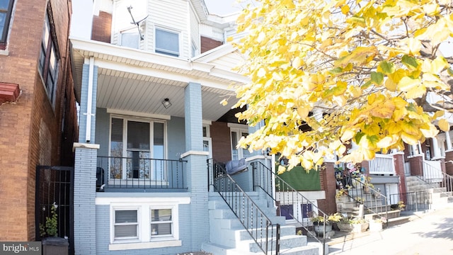 view of property featuring covered porch