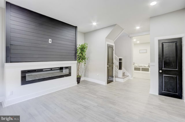 unfurnished living room featuring light hardwood / wood-style flooring