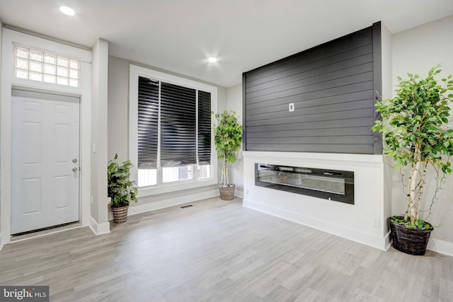 unfurnished living room with light hardwood / wood-style floors