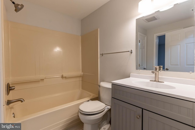 full bathroom with bathtub / shower combination, vanity, and toilet