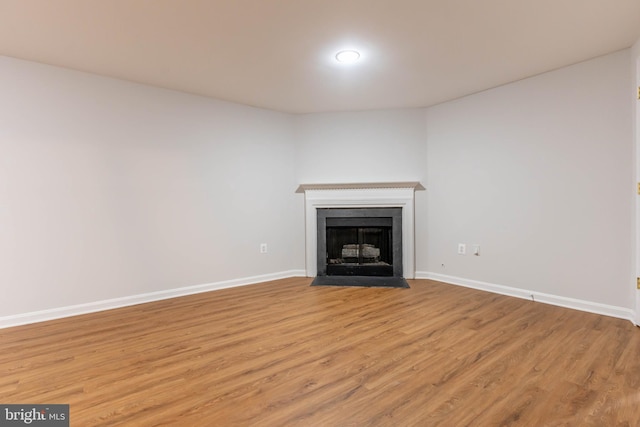 unfurnished living room with light hardwood / wood-style flooring