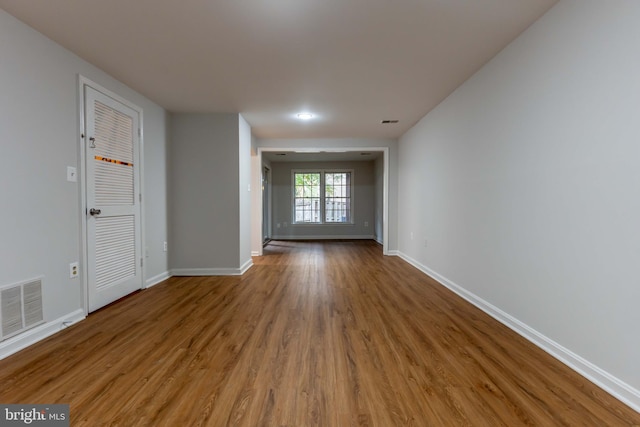 spare room featuring wood-type flooring