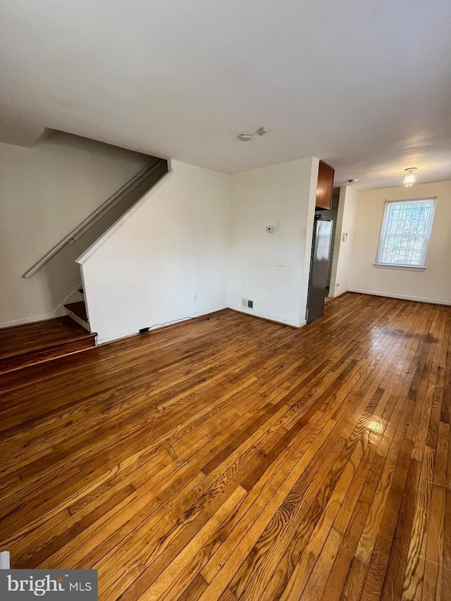 unfurnished living room with hardwood / wood-style floors