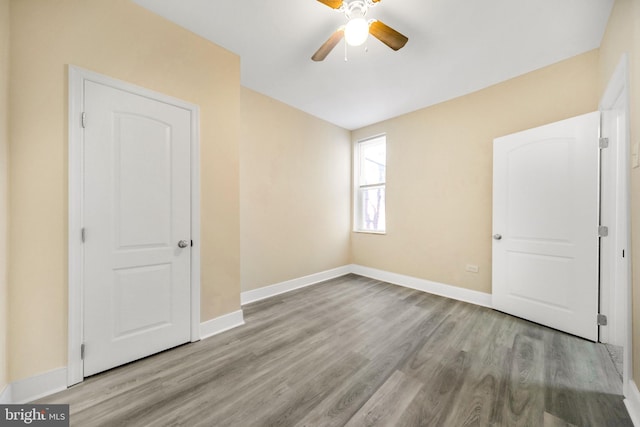 interior space with light wood-type flooring and ceiling fan