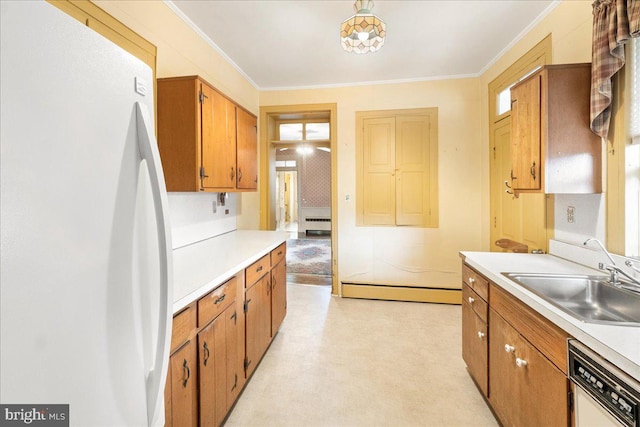 kitchen featuring dishwashing machine, sink, crown molding, and white refrigerator