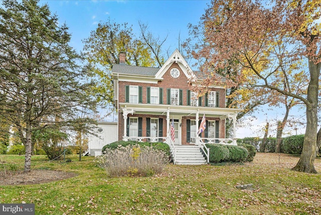 view of front facade with a porch and a front yard