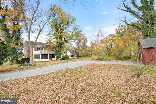 view of yard featuring a sunroom