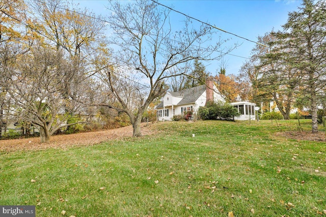 view of yard with a sunroom