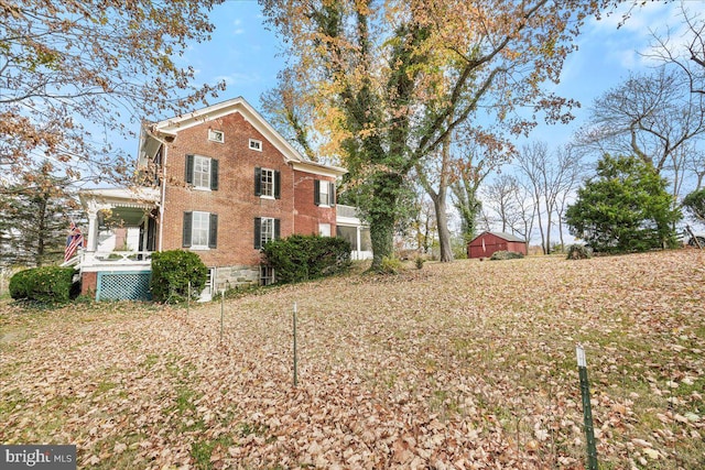 view of side of home with covered porch