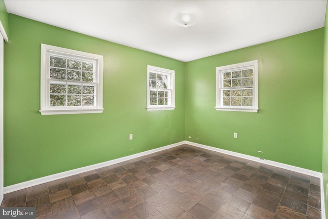 unfurnished room with a wealth of natural light