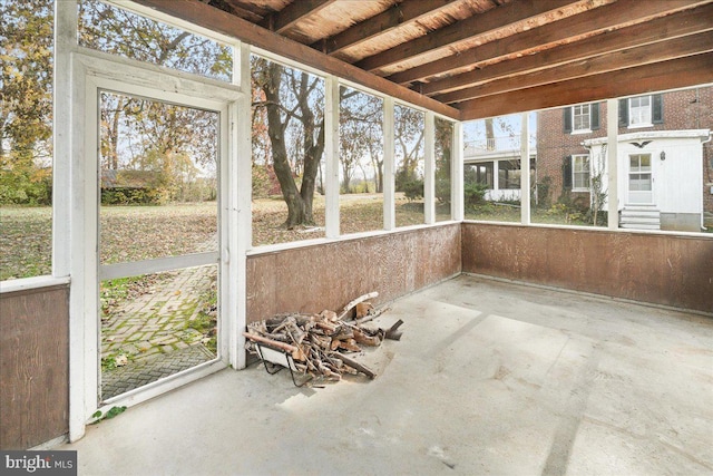 unfurnished sunroom featuring a wealth of natural light