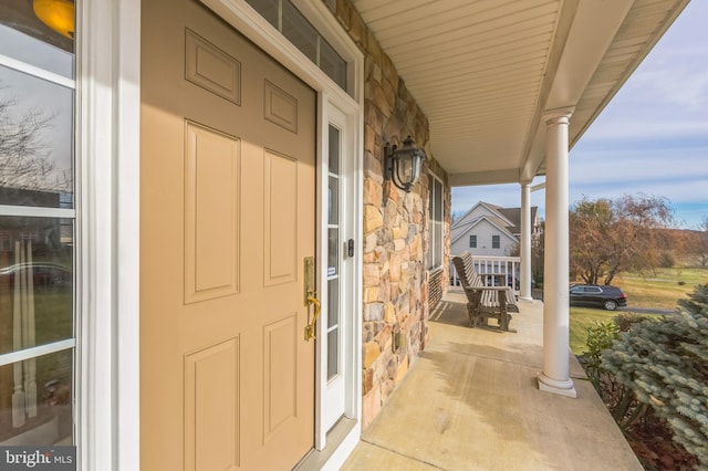 doorway to property with covered porch