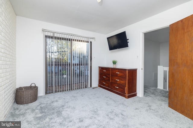 carpeted bedroom featuring access to outside