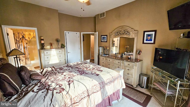 bedroom featuring ceiling fan and light carpet